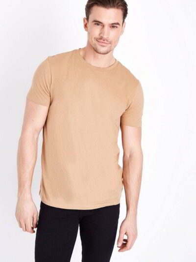 Close-up of folded bulk eco friendly t-shirts, showing soft texture, clean stitching. Neutral color palette, short sleeves. -