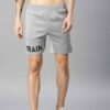 Heavyweight shorts, roomy fit. Textured fabric, robust stitching detail. Urban street style, likely cotton blend. Dark color,