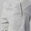 Heavyweight shorts, roomy fit. Textured fabric, robust stitching detail. Urban street style, likely cotton blend. Dark color,