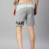Heavyweight shorts, roomy fit. Textured fabric, robust stitching detail. Urban street style, likely cotton blend. Dark color,