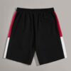 Close-up of athletic training shorts. Performance fabric with subtle texture, reinforced stitching. Breathable, moisture-wick