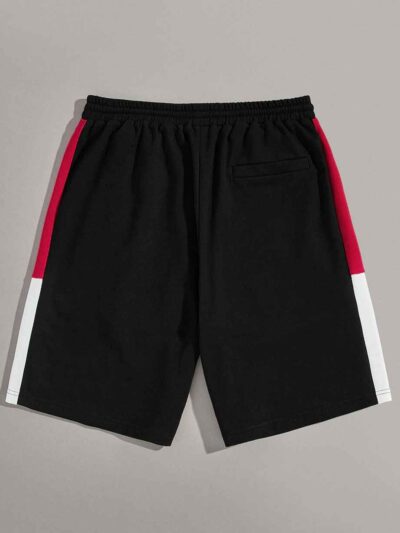 Close-up of athletic training shorts. Performance fabric with subtle texture, reinforced stitching. Breathable, moisture-wick