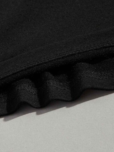 Close-up of athletic training shorts. Performance fabric with subtle texture, reinforced stitching. Breathable, moisture-wick
