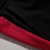 Close-up of athletic training shorts. Performance fabric with subtle texture, reinforced stitching. Breathable, moisture-wick