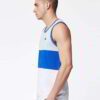 Close-up of bulk moisture wicking tank tops. Soft, breathable fabric with reinforced stitching. Ideal for workout wear, vibra