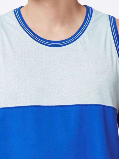 Close-up of bulk moisture wicking tank tops. Soft, breathable fabric with reinforced stitching. Ideal for workout wear, vibra