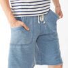 Close-up of bulk workout shorts. Soft, heathered gray fabric, durable reinforced stitching. Elastic waistband, athletic fit,