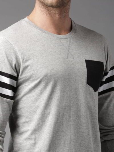 Pile of vibrant college t-shirts: soft cotton feel, durable stitching. Mix of classic crewneck & modern v-neck styles. Great