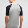 Stacked navy t-shirts, custom printed with bold white statements. Notice the soft-feel cotton texture and durable double-stit