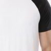 Stack of vibrant custom t-shirts, close-up. Soft cotton texture, neat seams. Short-sleeve crew necks, various colors visible.