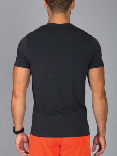 Close-up: Navy work shirt, bulk printed logo. Durable twill weave, reinforced stitching. Practical, professional, & customiza