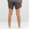 Lightweight beach shorts with vibrant, all-over sublimation print. Notice the fine stitching and soft, breathable fabric text
