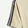 Close-up of folded t-shirts. Soft cotton knit texture, clean seams, consistent sizing. Blank canvas for apparel brands, subtl