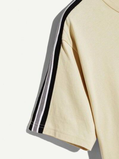 Close-up of folded t-shirts. Soft cotton knit texture, clean seams, consistent sizing. Blank canvas for apparel brands, subtl
