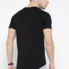 Close-up of neatly stacked tees. Soft cotton blend fabric, clean seams. Solid color assortment; hints of gray, navy, black. B