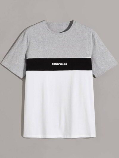 Stack of folded t-shirts, smooth cotton blend, close-stitched seams. Essential crew neck tees in solid colors, ready for reta