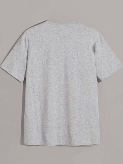 Stack of folded t-shirts, smooth cotton blend, close-stitched seams. Essential crew neck tees in solid colors, ready for reta