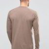 Close-up on a stack of vibrant, custom-printed tees. Notice the tight knit of the durable cotton and reinforced shoulder stit