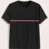 Close-up of a v-neck tee shirt, soft-looking knit fabric, clean stitching detail. Casual garment, available in multiple color