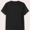 Close-up of a v-neck tee shirt, soft-looking knit fabric, clean stitching detail. Casual garment, available in multiple color