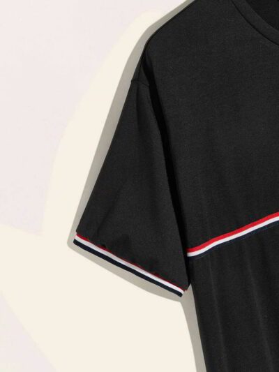 Close-up of a v-neck tee shirt, soft-looking knit fabric, clean stitching detail. Casual garment, available in multiple color