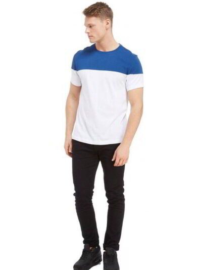Crisp white t-shirts, neatly stacked. Soft cotton knit with clean seams visible. Ready for custom printing, bright and pristi