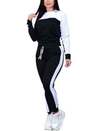 Pile of ladies' tracksuits in various colors. Soft, fleecy texture visible. Close stitching details shown on cuffs & seams. S