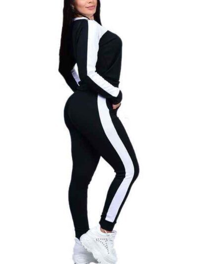 Pile of ladies' tracksuits in various colors. Soft, fleecy texture visible. Close stitching details shown on cuffs & seams. S