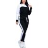 Pile of ladies' tracksuits in various colors. Soft, fleecy texture visible. Close stitching details shown on cuffs & seams. S