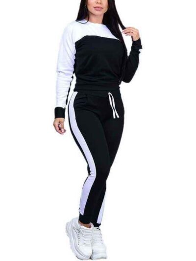 Pile of ladies' tracksuits in various colors. Soft, fleecy texture visible. Close stitching details shown on cuffs & seams. S