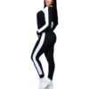 Pile of ladies' tracksuits in various colors. Soft, fleecy texture visible. Close stitching details shown on cuffs & seams. S