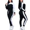 Pile of ladies' tracksuits in various colors. Soft, fleecy texture visible. Close stitching details shown on cuffs & seams. S