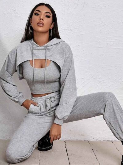 Women's fitness tracksuit and joggers set. Heather grey marl fabric, visible fine stitching. Soft, comfortable gym apparel.