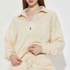 Women's track suit set: soft-looking, coral fleece. Ribbed cuffs, drawstrings. Custom design potential evident. Comfort & sty