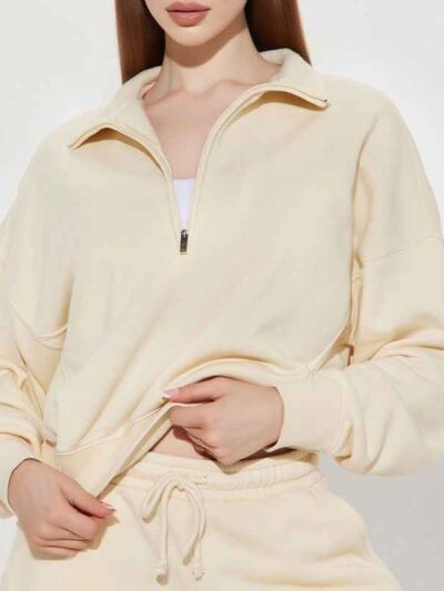 Women's track suit set: soft-looking, coral fleece. Ribbed cuffs, drawstrings. Custom design potential evident. Comfort & sty