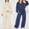 Women's track suit set: soft-looking, coral fleece. Ribbed cuffs, drawstrings. Custom design potential evident. Comfort & sty
