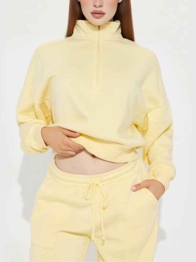 Women's track suit set: soft-looking, coral fleece. Ribbed cuffs, drawstrings. Custom design potential evident. Comfort & sty
