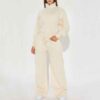 Women's track suit set: soft-looking, coral fleece. Ribbed cuffs, drawstrings. Custom design potential evident. Comfort & sty