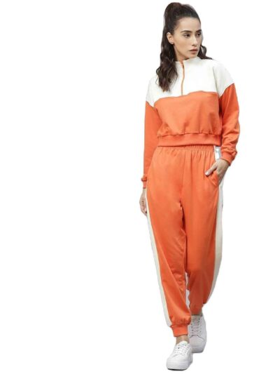 Velour tracksuit for women. Soft, plush texture. Note custom logo detail. Two-piece set in a rich, inviting hue. Quality stit