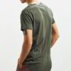Pile of soft, printed women's tees. Smooth cotton knit, vibrant designs, neat double-needle stitching. Comfortable everyday w