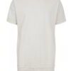 Stack of youth t-shirts. Soft cotton knit texture, clean seams. Various colors hinted: red, green, blue. Basic crewneck style