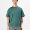 Oversized t-shirt, chest pocket detail. Soft jersey knit with visible dropshoulder seam. Hints of heather gray. Relaxed fit.