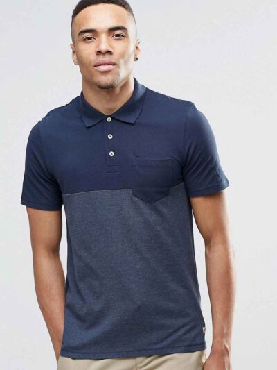 Color block polo shirt. Breathable, moisture wicking fabric with subtle texture. Clean stitching, short sleeves. Contrast col