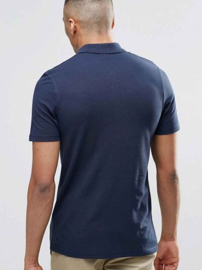 Color block polo shirt. Breathable, moisture wicking fabric with subtle texture. Clean stitching, short sleeves. Contrast col