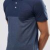 Color block polo shirt. Breathable, moisture wicking fabric with subtle texture. Clean stitching, short sleeves. Contrast col