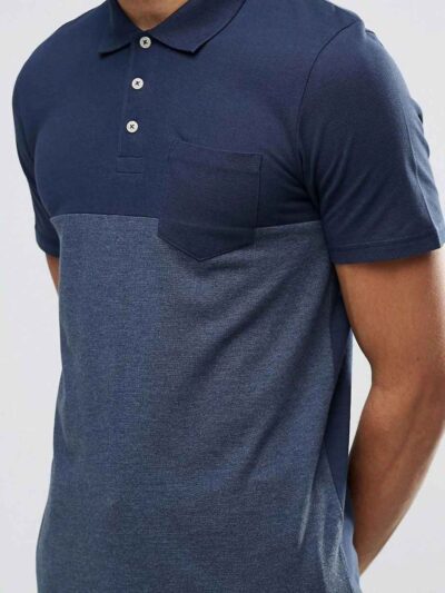 Color block polo shirt. Breathable, moisture wicking fabric with subtle texture. Clean stitching, short sleeves. Contrast col
