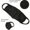 Cotton fabric face mask. Close-up reveals fine stitching, soft texture. Reusable mouth cover for adults. Available in multipl
