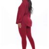 Black plus-size woman in a skinny fit tracksuit. Notice the smooth, matte fabric & strong, neat stitching. Figure-hugging sty