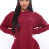 Black plus-size woman in a skinny fit tracksuit. Notice the smooth, matte fabric & strong, neat stitching. Figure-hugging sty