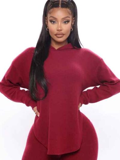 Black plus-size woman in a skinny fit tracksuit. Notice the smooth, matte fabric & strong, neat stitching. Figure-hugging sty